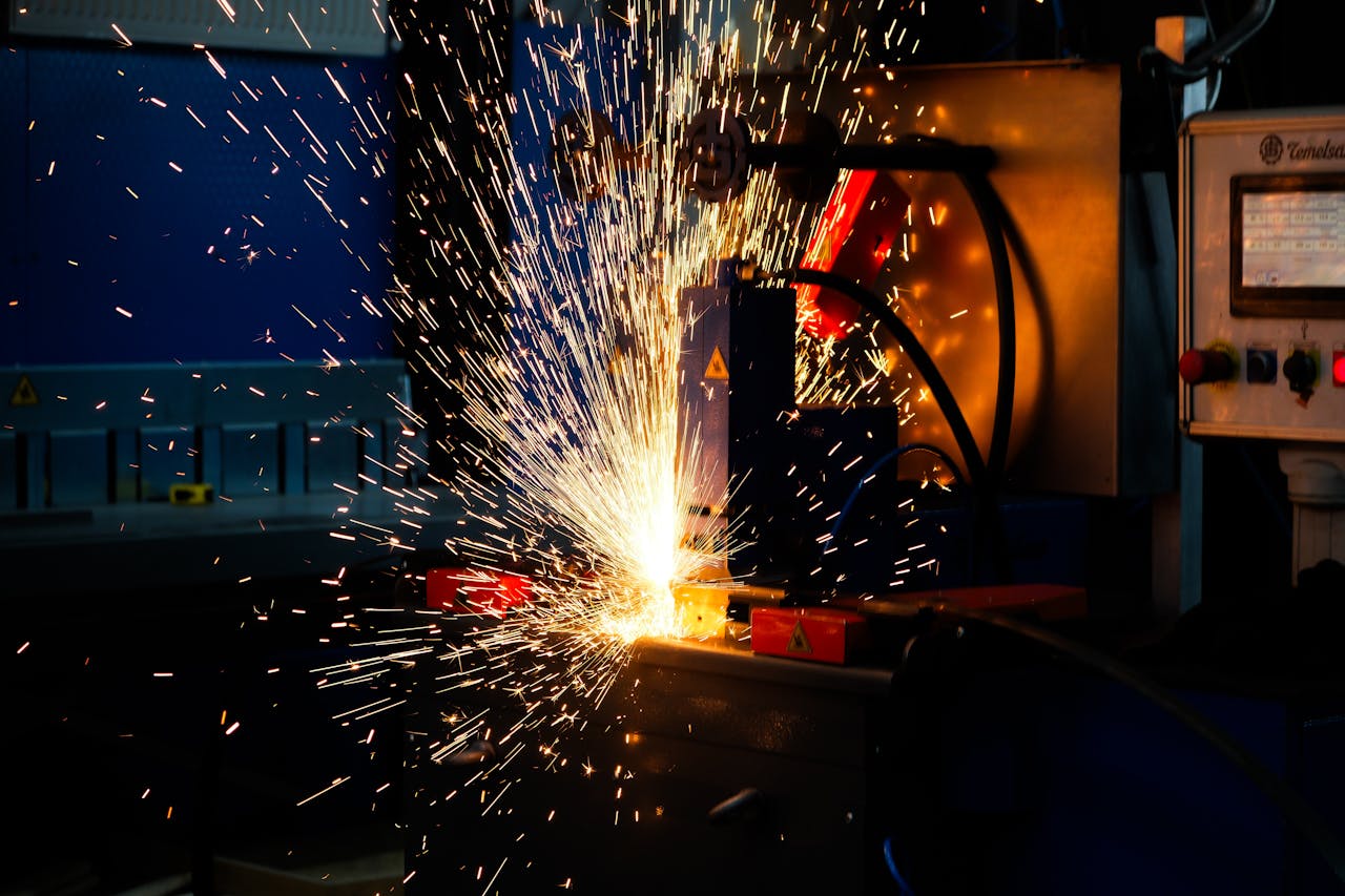 Vibrant display of welding sparks in an industrial setting, highlighting manufacturing processes.